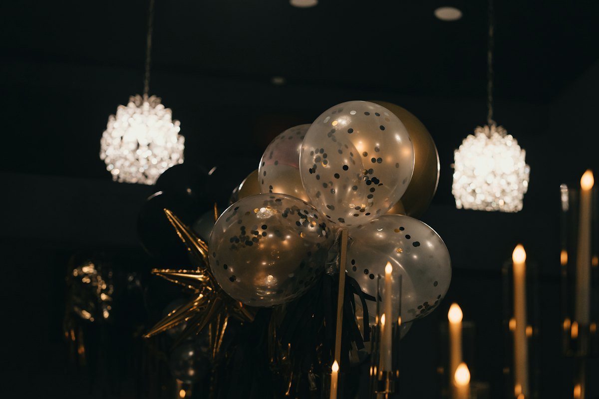 Balloons and warm festive lights set up as the guests arrive